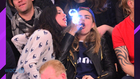 Michelle Rodriguez Gives Cara Delevingne A Sloppy Kiss At NBA Game, Then Does High Kicks With Gal Pal
